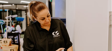 Woman working in a cleaning facility.