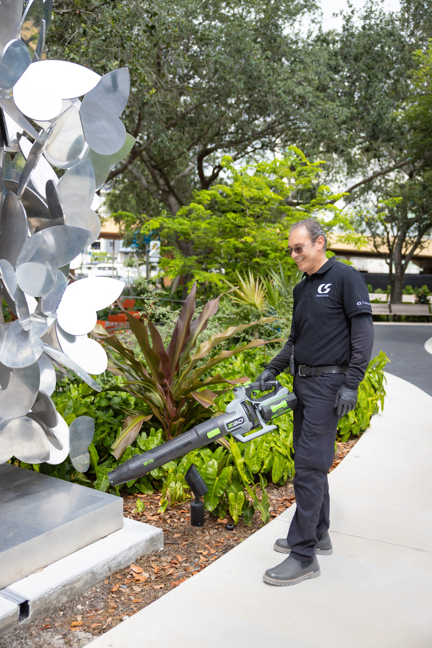 Clean Space porter leaf blowing a landscaped walkway in Fort Lauderdale, Florida